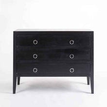 Load image into Gallery viewer, a black piece of luggage sitting on top of a dresser