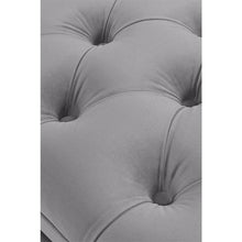 Load image into Gallery viewer, a black and white photo of a person laying on a couch