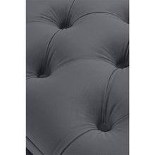 Load image into Gallery viewer, a black and white photo of a person laying on a couch