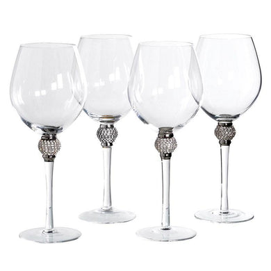 a group of wine glasses sitting on a table 